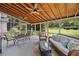 Inviting screened porch featuring a seating area, dining table, and backyard views at 514 Augusta Dr, Canton, GA 30115