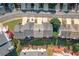 An aerial view captures the neighborhood's layout with visible roofs, trees, and back patios at 6004 Turfway Park Ct, Sugar Hill, GA 30518