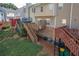 Back exterior view showing raised wooden decks and stairways of the townhome community at 6004 Turfway Park Ct, Sugar Hill, GA 30518