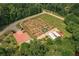 An aerial perspective reveals a community garden with organized plots and parking at 6004 Turfway Park Ct, Sugar Hill, GA 30518