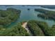 Expansive lake view surrounded by lush green trees, showcasing a serene and natural environment near the water at 6004 Turfway Park Ct, Sugar Hill, GA 30518