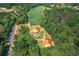 Overhead image displaying a well-kept park amidst lush greenery, featuring a covered picnic area and playground at 6004 Turfway Park Ct, Sugar Hill, GA 30518