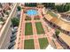 Aerial view of a vibrant town center with a splash pad, green spaces, and walking paths, creating a community gathering place at 6004 Turfway Park Ct, Sugar Hill, GA 30518
