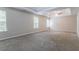 This spacious bedroom boasts a trey ceiling and plush carpet, perfect for relaxation at 7190 Cavender Sw Dr, Atlanta, GA 30331