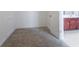 Bedroom featuring plush carpeting, clean white walls, and entry to the bathroom at 7190 Cavender Sw Dr, Atlanta, GA 30331
