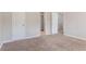 Neutral bedroom features plush carpeting, closet, and doorway to the rest of the home at 7190 Cavender Sw Dr, Atlanta, GA 30331