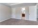 Neutral bedroom with walk-in closet and adjoining bathroom, offering comfort and convenience at 7190 Cavender Sw Dr, Atlanta, GA 30331