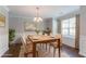Cozy dining room with table set, large windows, and elegant decor at 7190 Cavender Sw Dr, Atlanta, GA 30331