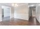 Inviting dining area with hardwood floors, decorative wainscoting, and stylish lighting at 7190 Cavender Sw Dr, Atlanta, GA 30331