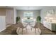 A dining area with a stylish table, elegant decor, and wood flooring at 7190 Cavender Sw Dr, Atlanta, GA 30331