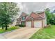 Handsome brick home with a two-car garage and manicured landscaping at 7190 Cavender Sw Dr, Atlanta, GA 30331