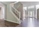 Grand foyer featuring hardwood floors, a staircase, and a view of the entryway at 7190 Cavender Sw Dr, Atlanta, GA 30331