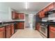 Well-equipped kitchen featuring tile floors, granite countertops, and stainless steel appliances at 7190 Cavender Sw Dr, Atlanta, GA 30331