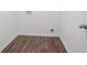 The laundry room has vinyl flooring, white walls and washer and dryer connections at 7190 Cavender Sw Dr, Atlanta, GA 30331