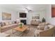 A welcoming living room with a fireplace, plush seating, and stylish decor at 7190 Cavender Sw Dr, Atlanta, GA 30331