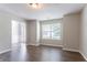Inviting living space featuring hardwood floors, neutral paint, and ample natural light at 7190 Cavender Sw Dr, Atlanta, GA 30331