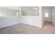Open loft area featuring carpet flooring, neutral walls, and an open layout at 7190 Cavender Sw Dr, Atlanta, GA 30331