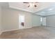 Large primary bedroom features a trey ceiling, plush carpet, and adjoins the bathroom at 7190 Cavender Sw Dr, Atlanta, GA 30331