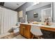 Bathroom featuring gray walls, wood floors, vanity area and shower at 130 Nacoochee Way, Canton, GA 30114