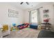 Well-lit bedroom with cartoon artwork and soft carpet at 130 Nacoochee Way, Canton, GA 30114