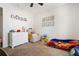 Charming bedroom featuring carpeted floor and a 'Cars' themed bed, perfect for a young  at 130 Nacoochee Way, Canton, GA 30114