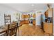 Spacious eat-in kitchen with stainless steel appliances, wood cabinets, and hardwood flooring at 130 Nacoochee Way, Canton, GA 30114