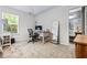 Neutral-toned bedroom with large desk space and view to an en suite bathroom at 130 Nacoochee Way, Canton, GA 30114