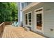 Wooden deck with outdoor seating, providing a serene space overlooking the lush yard at 2700 Still Farms Ct, Lawrenceville, GA 30043
