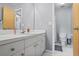 Bathroom with a white vanity, gray walls, and white tile floors; toilet is in the corner at 2700 Still Farms Ct, Lawrenceville, GA 30043