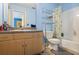 Light blue bathroom featuring a toilet, shower and sink vanity at 2700 Still Farms Ct, Lawrenceville, GA 30043