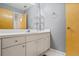 Bathroom with a white vanity with drawers, cabinets, large mirror, and gray walls at 2700 Still Farms Ct, Lawrenceville, GA 30043