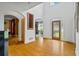 Bright foyer with gleaming hardwood floors and tall ceilings that create an inviting entry space at 2700 Still Farms Ct, Lawrenceville, GA 30043