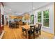 Bright kitchen with stainless steel appliances, an island with seating, and dining area at 2700 Still Farms Ct, Lawrenceville, GA 30043
