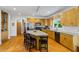 Well-equipped kitchen with wood cabinets, stainless steel appliances, and an island at 2700 Still Farms Ct, Lawrenceville, GA 30043