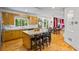 Open kitchen with an island, stainless appliances, and connection to the dining and living areas at 2700 Still Farms Ct, Lawrenceville, GA 30043