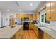 Modern kitchen featuring wood cabinets, an island, and ample counter space at 2700 Still Farms Ct, Lawrenceville, GA 30043
