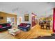 Open floor plan featuring hardwood floors connecting the living room to dining and kitchen at 2700 Still Farms Ct, Lawrenceville, GA 30043