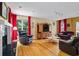 Inviting living room featuring hardwood floors, a fireplace, and comfortable seating at 2700 Still Farms Ct, Lawrenceville, GA 30043
