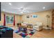 Inviting living room with hardwood floors, two armchairs, a ceiling fan, and large window at 2700 Still Farms Ct, Lawrenceville, GA 30043