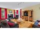 Comfortable living room with hardwood floors, fireplace, and abundant natural light at 2700 Still Farms Ct, Lawrenceville, GA 30043