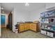 Spacious utility room with laminate countertop, wooden cabinets, and storage shelves at 2700 Still Farms Ct, Lawrenceville, GA 30043