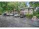 Apartment complex exterior with well-maintained parking and neat landscaping at 5157 Roswell Rd # 1, Atlanta, GA 30342