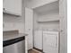 A compact laundry closet includes a washer and dryer, maximizing convenience at 5157 Roswell Rd # 1, Atlanta, GA 30342
