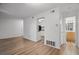Spacious Living room with hardwood floors, white walls, leading into the kitchen and bathroom at 5157 Roswell Rd # 1, Atlanta, GA 30342