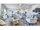 Open-concept living room and kitchen features modern decor and plenty of space at 620 Lobelia Way, Locust Grove, GA 30248