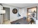 Bright home office featuring shelving, a desk, and decorative wall clock at 620 Lobelia Way, Locust Grove, GA 30248