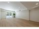 Finished basement featuring stylish wood floors, recessed lighting, and sliding glass doors to the backyard at 3350 Pine Meadow Nw Rd, Atlanta, GA 30327