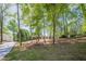 Brick home nestled among mature trees, offering a sense of privacy and tranquility at 3350 Pine Meadow Nw Rd, Atlanta, GA 30327