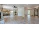 Open-concept living area with a modern kitchen, breakfast bar, stylish fireplace, and ample natural light at 3350 Pine Meadow Nw Rd, Atlanta, GA 30327
