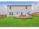 Expansive backyard with a wooden deck, seating area and lush green grass, perfect for outdoor enjoyment at 336 Freeman Cir, Villa Rica, GA 30180